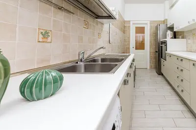 a kitchen with a sink and a counter top at A Casa di Federico e Nikki - Vatican City - Metro Baldo degli Ubaldi in Rome