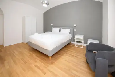 a bedroom with a bed and a couch at Boncompagni Serenity Suites in Rome