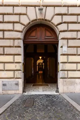 an entrance to a building with a large wooden door at Boncompagni Serenity Suites in Rome