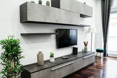 a living room with a tv on a wall at Vaticano-Cornelia Luxury Home in Rome