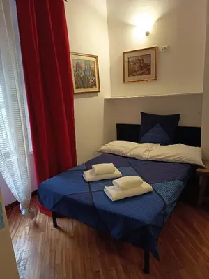 a bedroom with two beds with towels on them at Bilocale privato in Rome