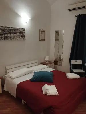 a bedroom with a bed with two towels on it at Bilocale privato in Rome