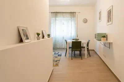 a dining room with a table and chairs at Vigna Clara apartment in Rome
