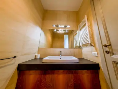 a bathroom with a sink and a mirror at Pop Apartment in the Heart of Trastevere 4 Guests in Rome