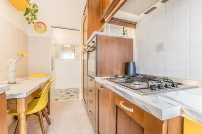 a kitchen with a stove and a counter top at Asinari Retreat in Rome