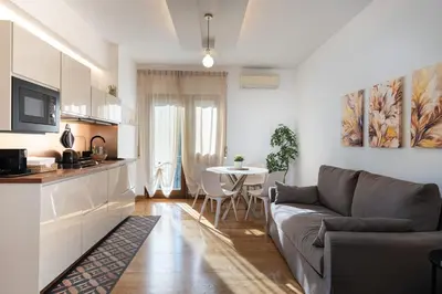 a living room with a couch and a table at Your Place in Rome Apartments in Rome