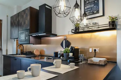 a kitchen with a counter with cups on it at Your Place in Rome Apartments in Rome