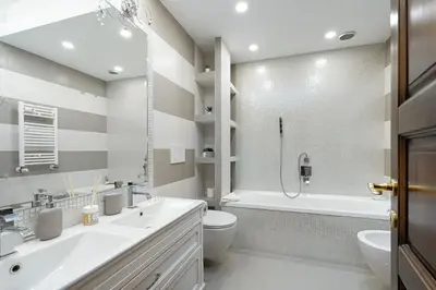 a bathroom with a sink and a toilet and a tub at Your Place in Rome Apartments in Rome