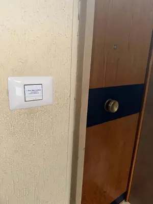 a door with a sign on the side of it at Your Place in Rome Apartments in Rome