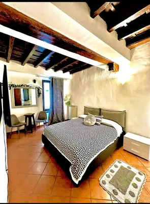 a bedroom with a bed in a room at Casa di Andrea in Trastevere in Rome