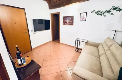 a living room with a couch and a table at Casa di Andrea in Trastevere in Rome