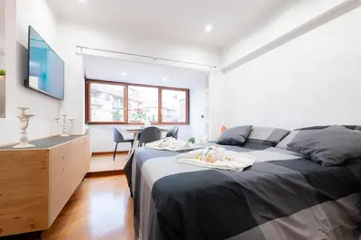 a bedroom with a bed and a table with chairs at Graffiti Sweet Home in Rome