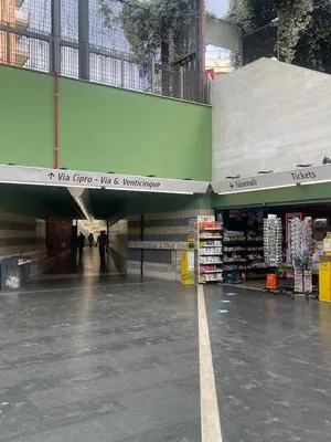 an empty shopping mall with people walking through it at Vatican Time apartment in Rome