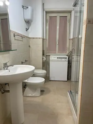 a bathroom with a sink and a toilet at Vatican Time apartment in Rome