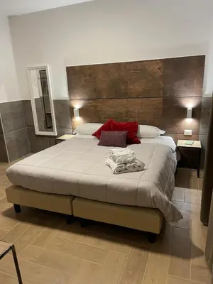a bedroom with a large bed in a room at San Silverio B&B in Rome