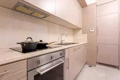 a kitchen with a sink and a pot on the stove at Spanish Steps Luxury Apartment in Rome
