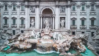 a large fountain in front of a building at Spanish Steps Luxury Apartment in Rome
