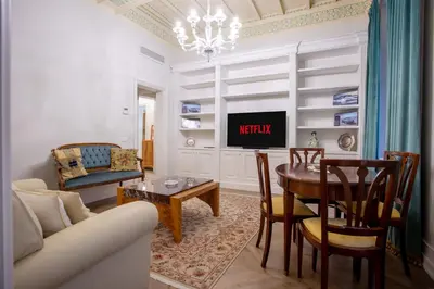 a living room with a couch and a table at Spanish Steps Luxury Apartment in Rome