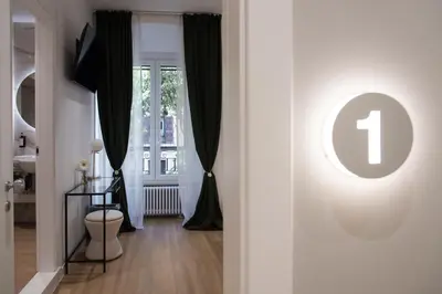 a room with a door with a number one sign on it at Colosseum suites by Glen in Rome
