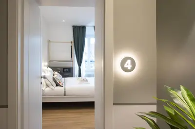 a bedroom with a bed and a window at Colosseum suites by Glen in Rome