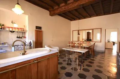 a kitchen with a large tub and a dining room at Navona Large 1BR Holiday House in Rome