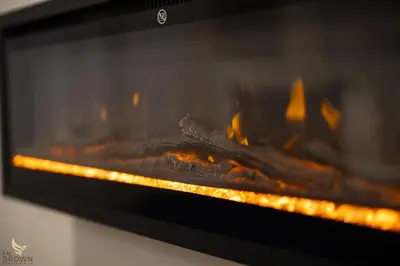 a fire is coming out of an oven at MrBrown - Dimora Lucrezia al Vaticano in Rome