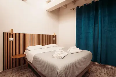 a bedroom with a bed with towels on it at NL Trastevere in Rome