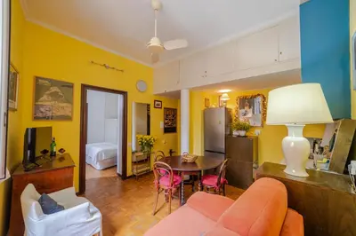 a living room with a couch and a table at Oasi Tiberina in Rome
