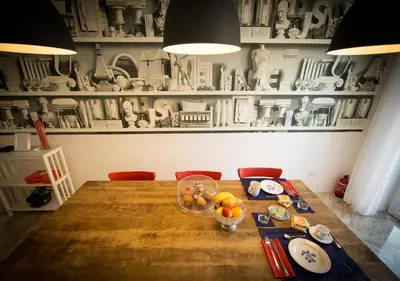 a dining room table with a bowl of fruit on it at B&B Roma 474 in Rome