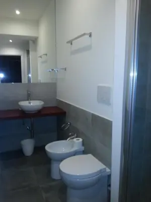 a bathroom with a toilet and a sink at B&B Roma 474 in Rome
