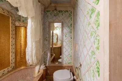 a bathroom with a toilet and a tub and a mirror at Casa dell'Opera LUXURY STAY in Rome
