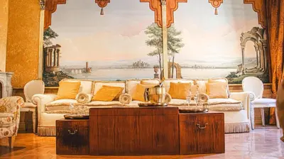 a living room with a couch and a painting at Casa dell'Opera LUXURY STAY in Rome