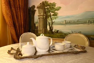a table with a tea set on top of it at Casa dell'Opera LUXURY STAY in Rome