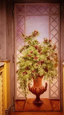 a plant in a vase in front of a door at Casa dell'Opera LUXURY STAY in Rome