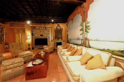 a living room with couches and a painting on the wall at Casa dell'Opera LUXURY STAY in Rome
