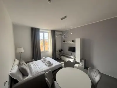 a living room with a couch and a table at Travel House in Rome