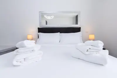 a bedroom with a bed with white towels on it at Travel House in Rome