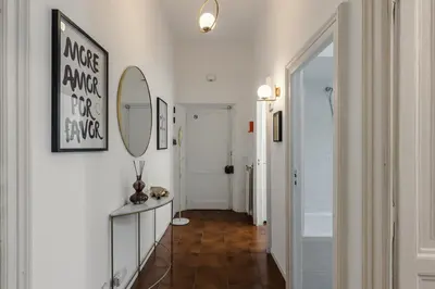 a hallway with a mirror on the wall and a mirror at Macro House in Rome