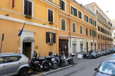 a row of motorcycles parked on the side of a street at Macro House in Rome