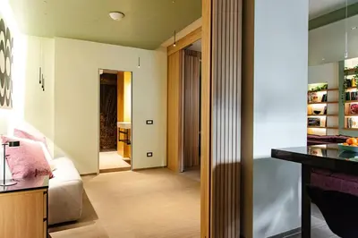 a room with a kitchen and a living room at Fabiolous suites in Rome