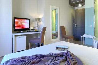 a hotel room with a bed and a tv on a counter at Domus Adriani in Rome
