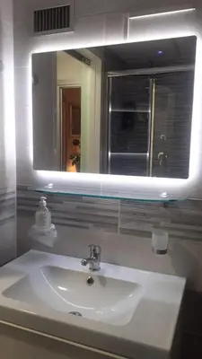 a bathroom with a white sink and a mirror at Roma Centro appartamento in Rome