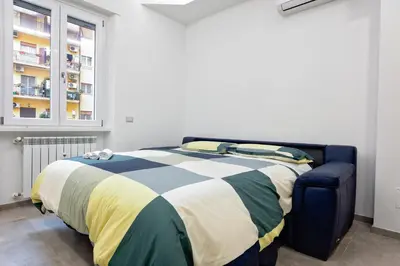 a bedroom with a bed and a window at OASIS Of PEACE CLOSE TO VATICANO in Rome