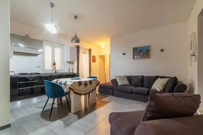 a living room with a couch and a table at GuestHost - Garbatella Comfy Apartment in Rome