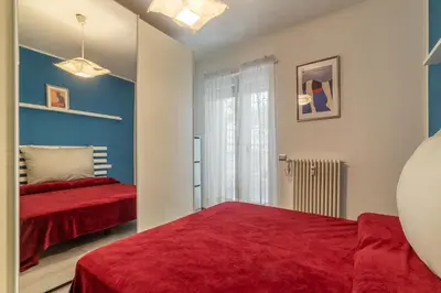 a bedroom with two beds and a window at GuestHost - Garbatella Comfy Apartment in Rome