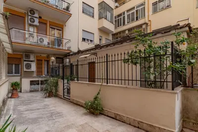 a balcony of an apartment building with plants at GuestHost - Garbatella Comfy Apartment in Rome