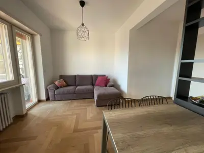 a living room with a couch and a tv at la casa di Janis in Rome