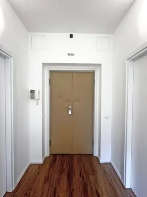 an empty hallway with a door in a white room at Roma Parioli - Manfredi Suites appartamento in Rome