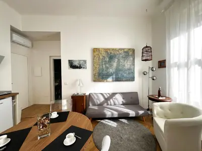 a living room with a couch and a table at Roma Parioli - Manfredi Suites appartamento in Rome