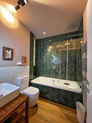 a bathroom with a tub and a toilet and a sink at Roma Parioli - Manfredi Suites appartamento in Rome